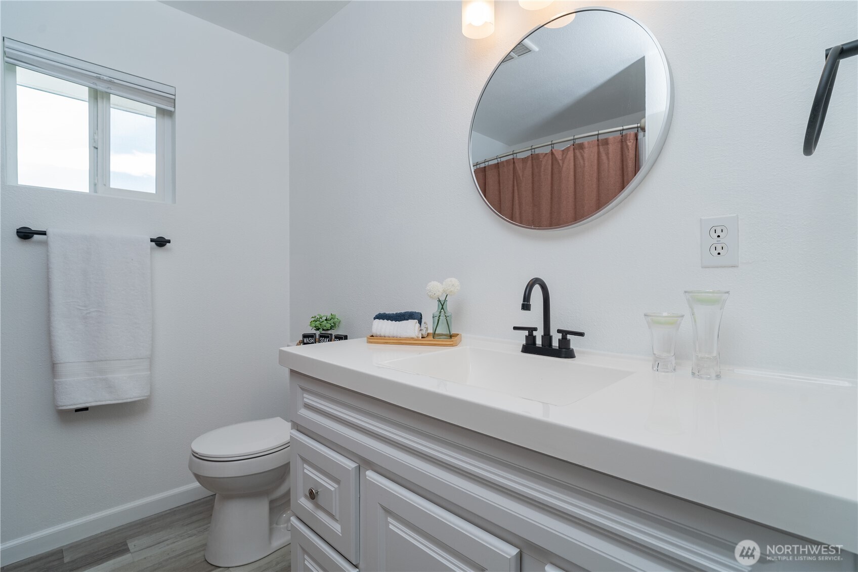 10327 185th Avenue Southwest Rochester, WA 98579 - Photo 13 of 27 a bathroom with a toilet a sink and mirror