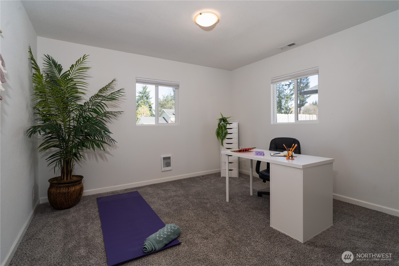 10327 185th Avenue Southwest Rochester, WA 98579 - Photo 15 of 27 a living room with furniture and a potted plant