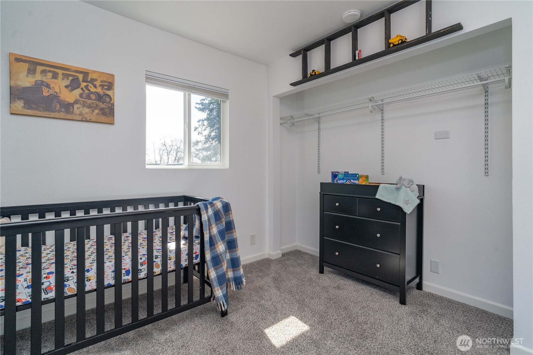 10327 185th Avenue Southwest Rochester, WA 98579 - Photo 18 of 27 a bedroom with a bed and a window