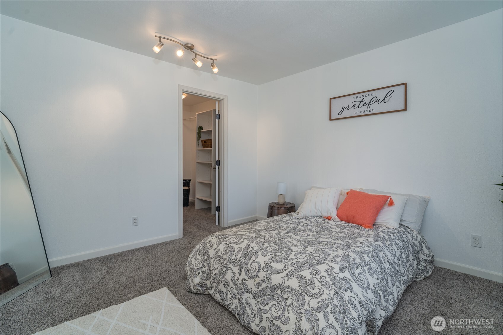 10327 185th Avenue Southwest Rochester, WA 98579 - Photo 20 of 27 a bedroom with a bed and a book shelf