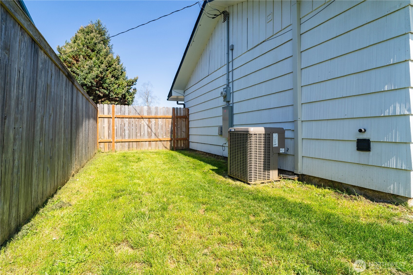 10327 185th Avenue Southwest Rochester, WA 98579 - Photo 27 of 27 a view of backyard with large trees and wooden fence