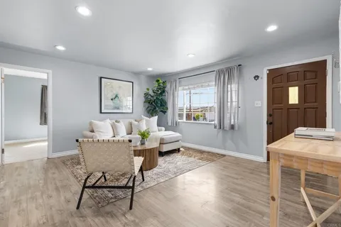 a living room with furniture and a table