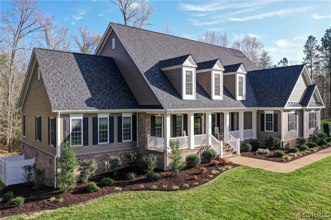 3419 Westport Williamsburg, VA 23188 - Photo 1 of 50 a front view of a house with a yard table and chairs