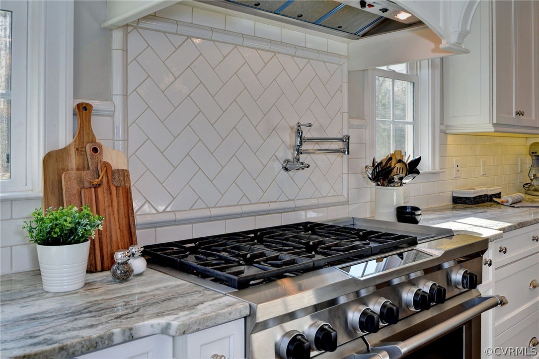 3419 Westport Williamsburg, VA 23188 - Photo 16 of 50 a kitchen with a stove and a white cabinet