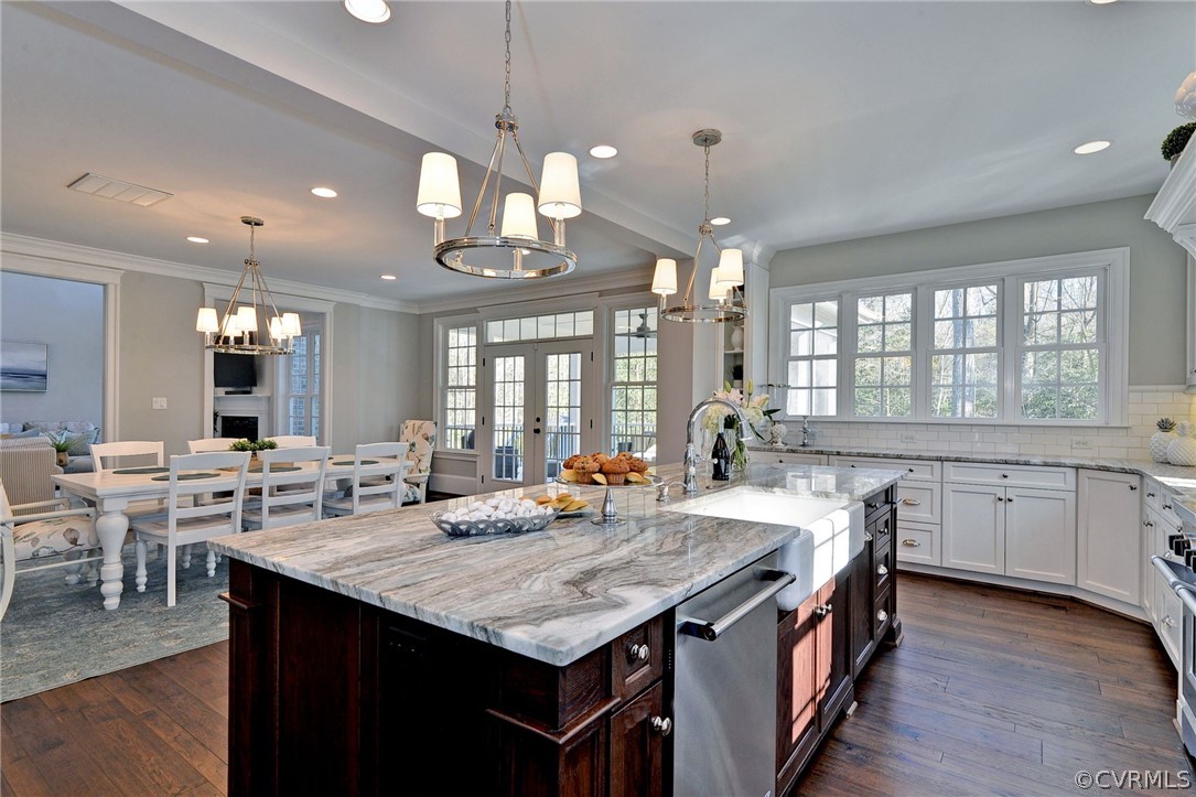 3419 Westport Williamsburg, VA 23188 - Photo 17 of 50 a large kitchen with kitchen island a sink table and chairs