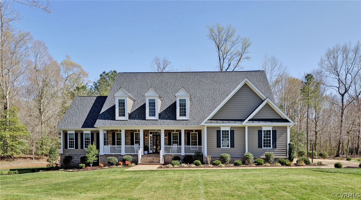 3419 Westport Williamsburg, VA 23188 - Photo 2 of 50 a front view of a house with garden and trees