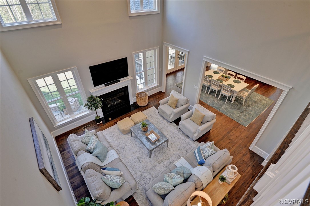 3419 Westport Williamsburg, VA 23188 - Photo 31 of 50 a living room with furniture a flat screen tv and a fireplace