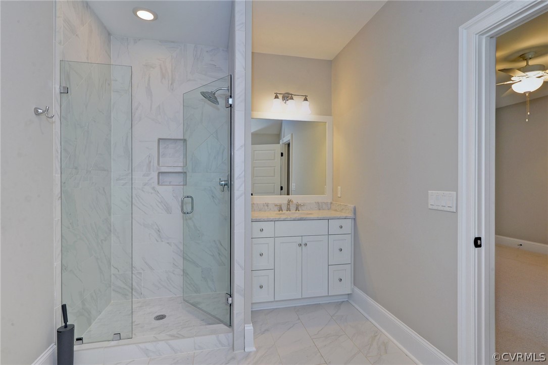 3419 Westport Williamsburg, VA 23188 - Photo 38 of 50 a bathroom with a shower sink and mirror