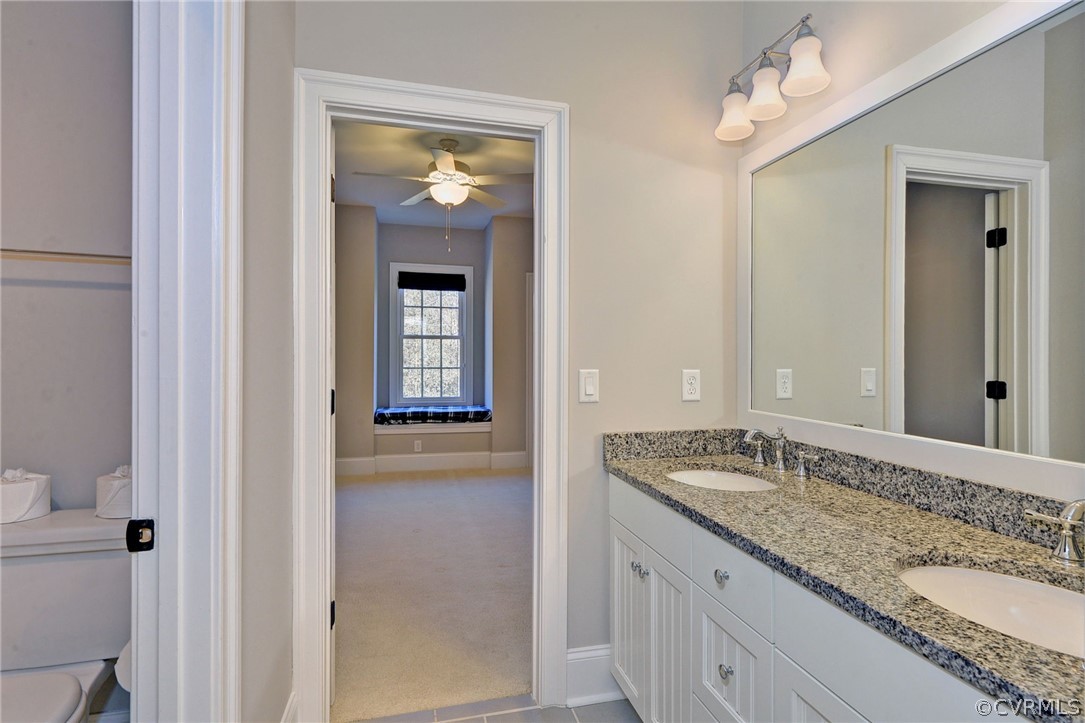 3419 Westport Williamsburg, VA 23188 - Photo 40 of 50 a bathroom with a granite countertop sink and a mirror