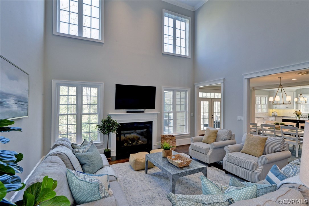 3419 Westport Williamsburg, VA 23188 - Photo 9 of 50 a living room with furniture a fireplace and a flat screen tv