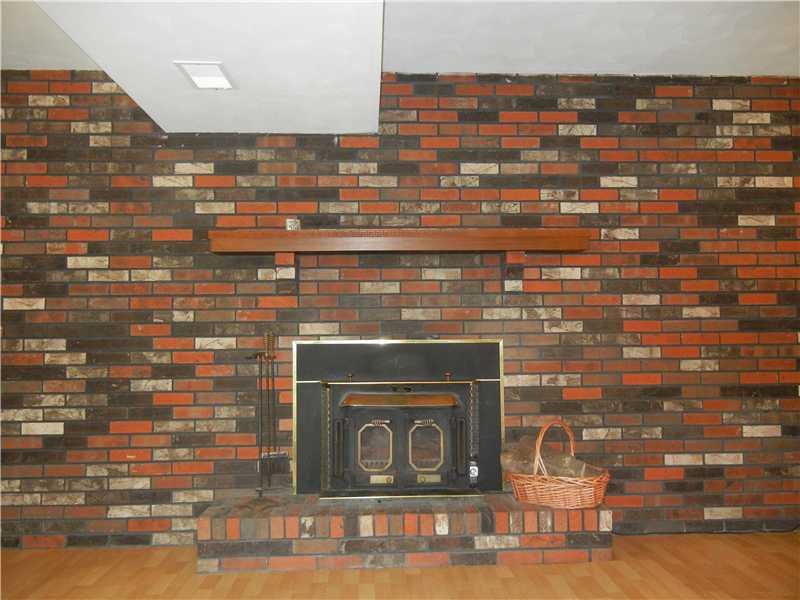 1006 Government Road Irwin, PA 15642 - Photo 18 of 20 Den/Family/Great Room. Wood Burning Brick Fireplace with New Insert
