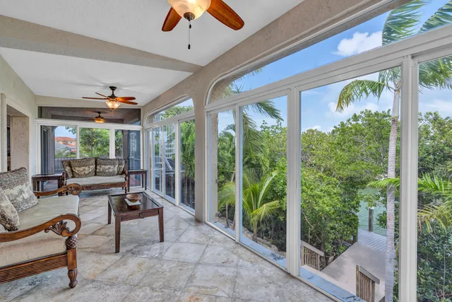 a building outdoor space with patio furniture and potted plants