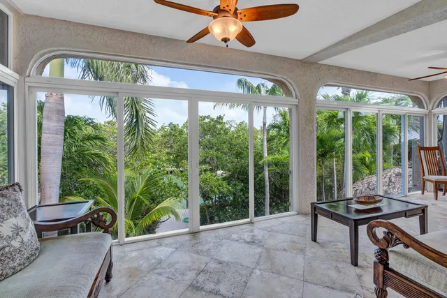 a living room with large windows