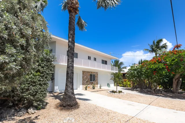 a view of a chairs and table in the patio