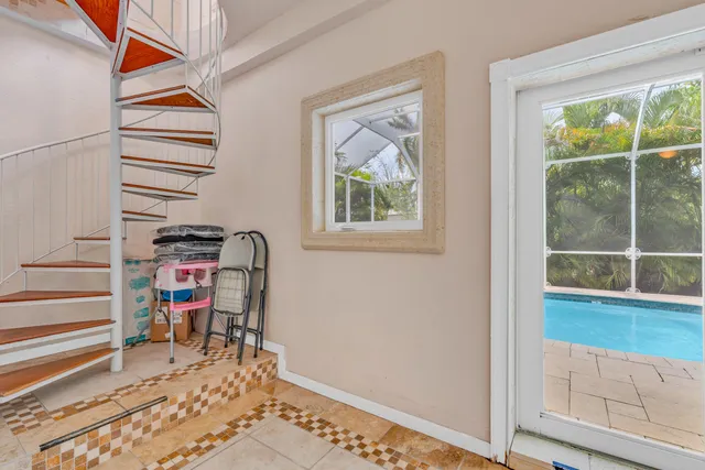 a view of a livingroom with wooden floor and a window