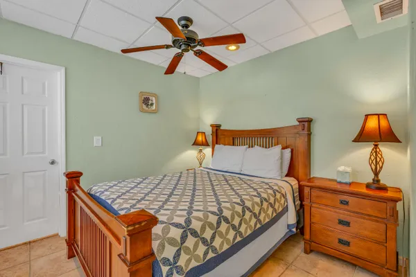 a bedroom with a bed and a dresser