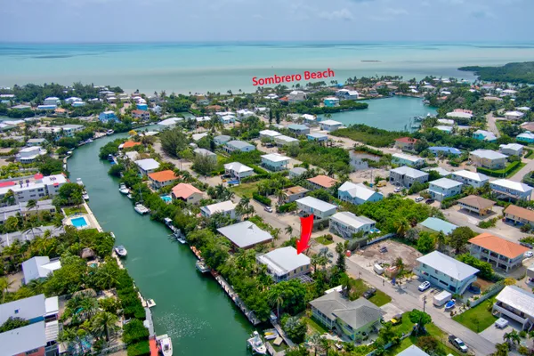 an aerial view of a houses and an outdoor space