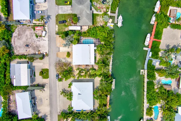 an aerial view of residential house with outdoor space and swimming pool