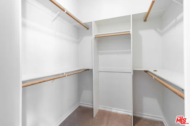 a view of an empty walk in closet
