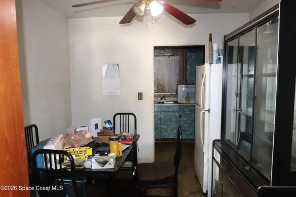 a dining room with furniture and a chandelier
