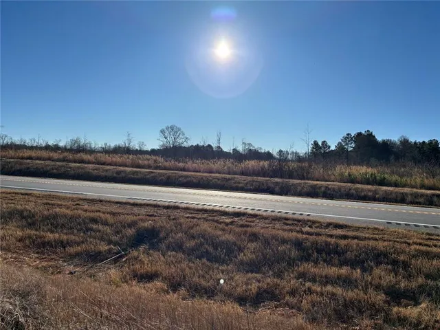 a view of a pathway to a yard