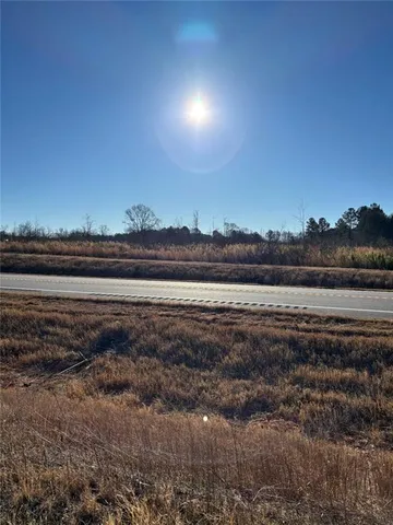 a view of a lake with sunset
