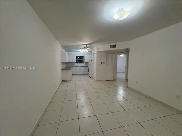 a view of a livingroom with an empty space and a sink