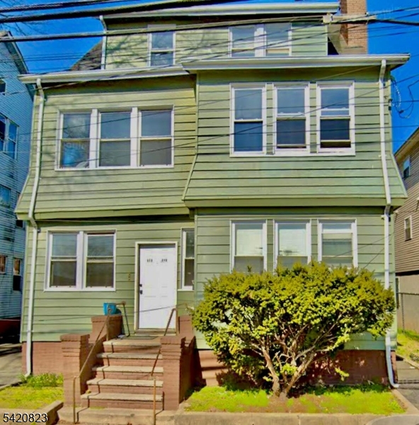 313 Leslie Street Newark, NJ 07112 - Photo 1 of 7 a front view of a house