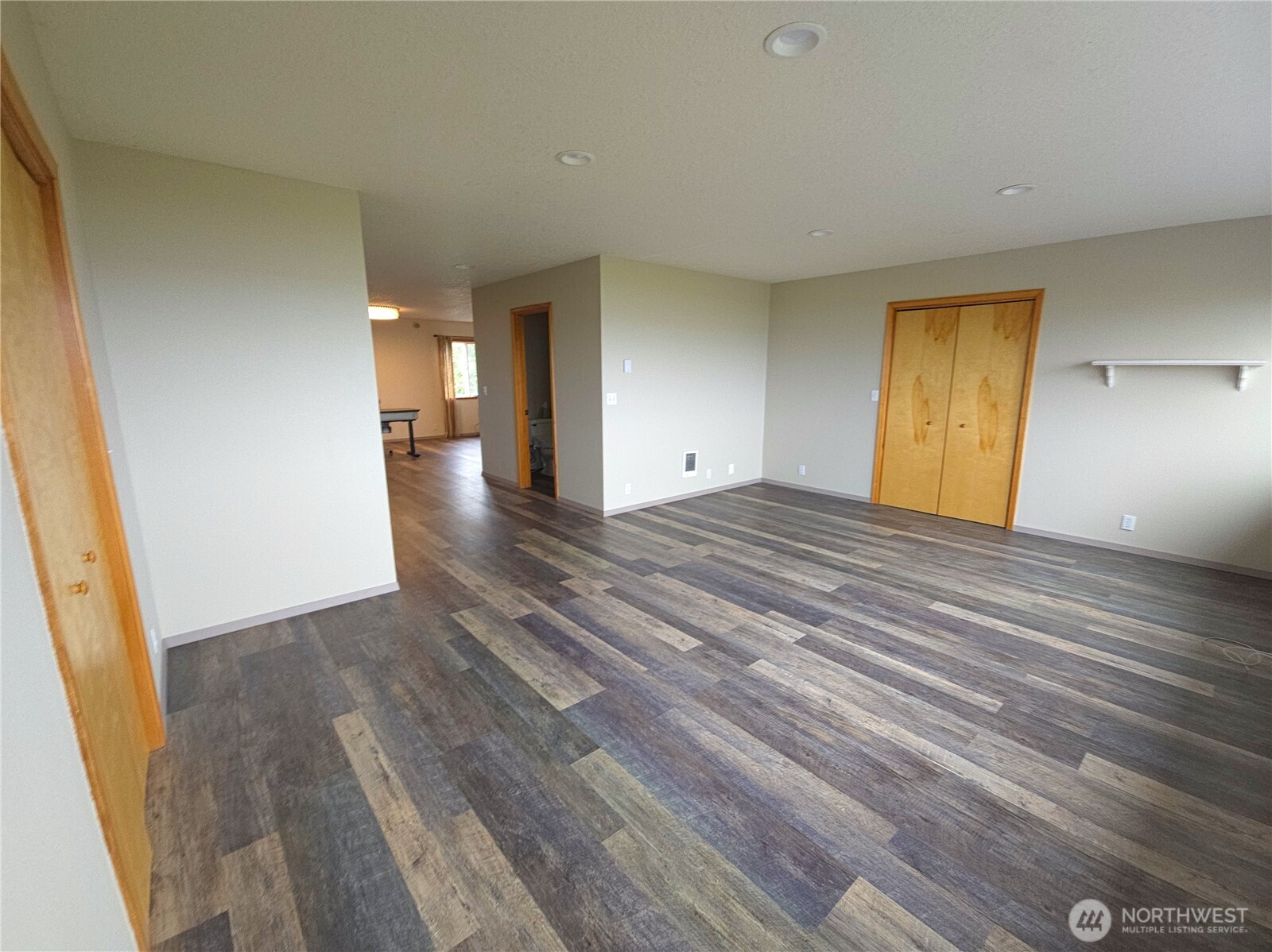 240 Stringtown Road Ilwaco, WA 98624 - Photo 16 of 39 a view of empty room with wooden floor
