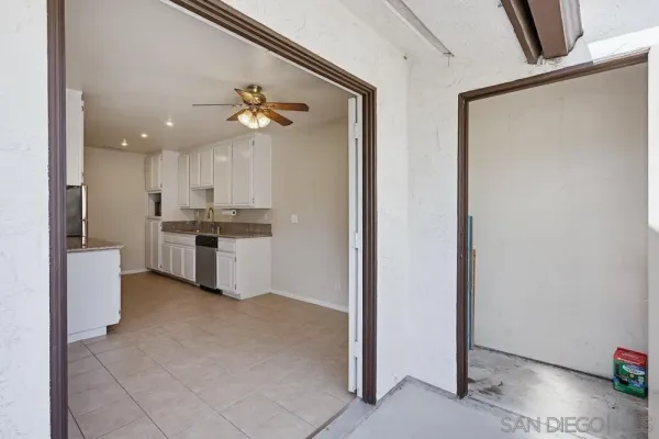 a kitchen with stainless steel appliances a refrigerator sink and cabinets