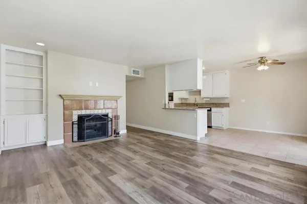 a view of kitchen with granite countertop window and a fireplace