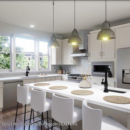 156-58 West Front Street, Unit 15 Keyport, NJ 07735 - Photo 2 of 20 a kitchen with a stove a sink a center island and cabinets