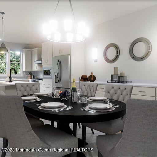 156-58 West Front Street, Unit 15 Keyport, NJ 07735 - Photo 3 of 20 a kitchen with a dining table and chairs