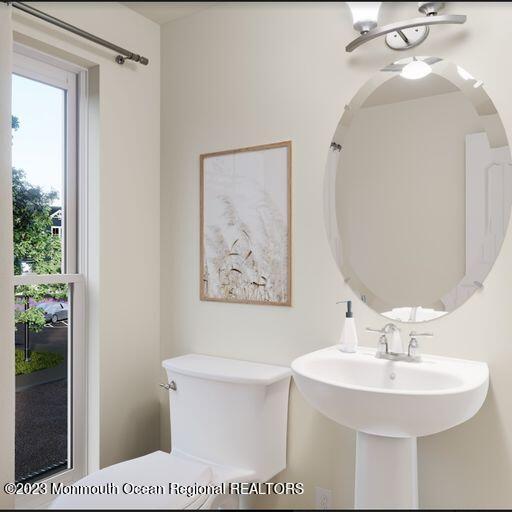 156-58 West Front Street, Unit 15 Keyport, NJ 07735 - Photo 5 of 20 a bathroom with a sink a toilet and shower
