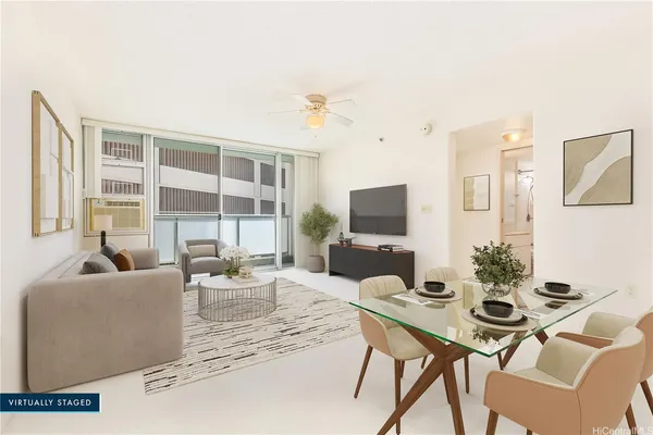 a living room with furniture a flat screen tv and a large window