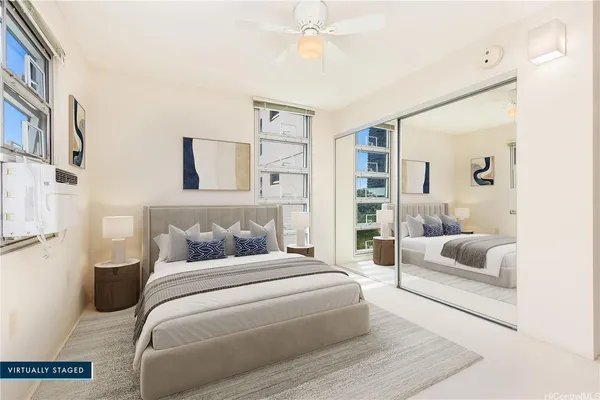 a bedroom with a bed and a couch