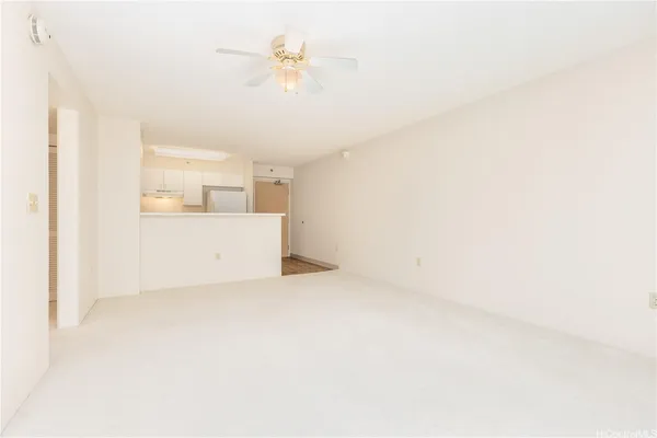a view of an empty room with a bathroom