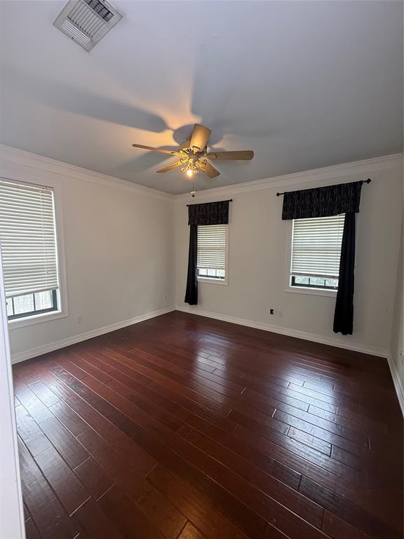 201 Woodhaven Drive Minden, LA 71055 - Photo 22 of 31 Spacious room featuring rich wood-finish flooring and multiple windows with blinds