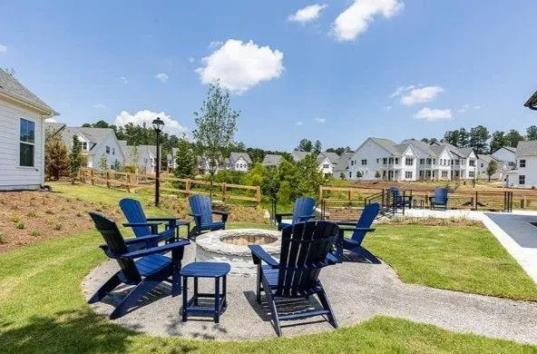 a view of a swimming pool and a back yard
