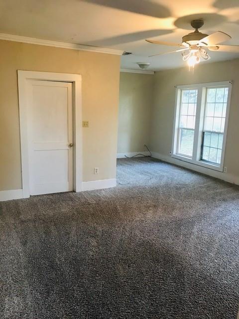 106 West Decatur Street Ennis, TX 75119 - Photo 14 of 17 en empty room with windows and closet