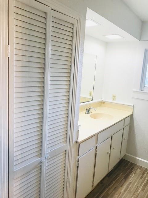 106 West Decatur Street Ennis, TX 75119 - Photo 15 of 17 a bathroom with a sink and a mirror