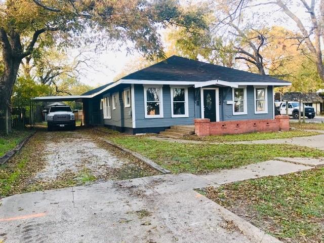 106 West Decatur Street Ennis, TX 75119 - Photo 17 of 17 front view of a house with a yard