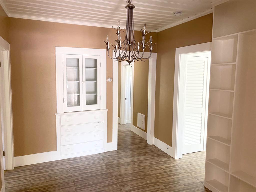 106 West Decatur Street Ennis, TX 75119 - Photo 5 of 17 a view of a chandelier in a room