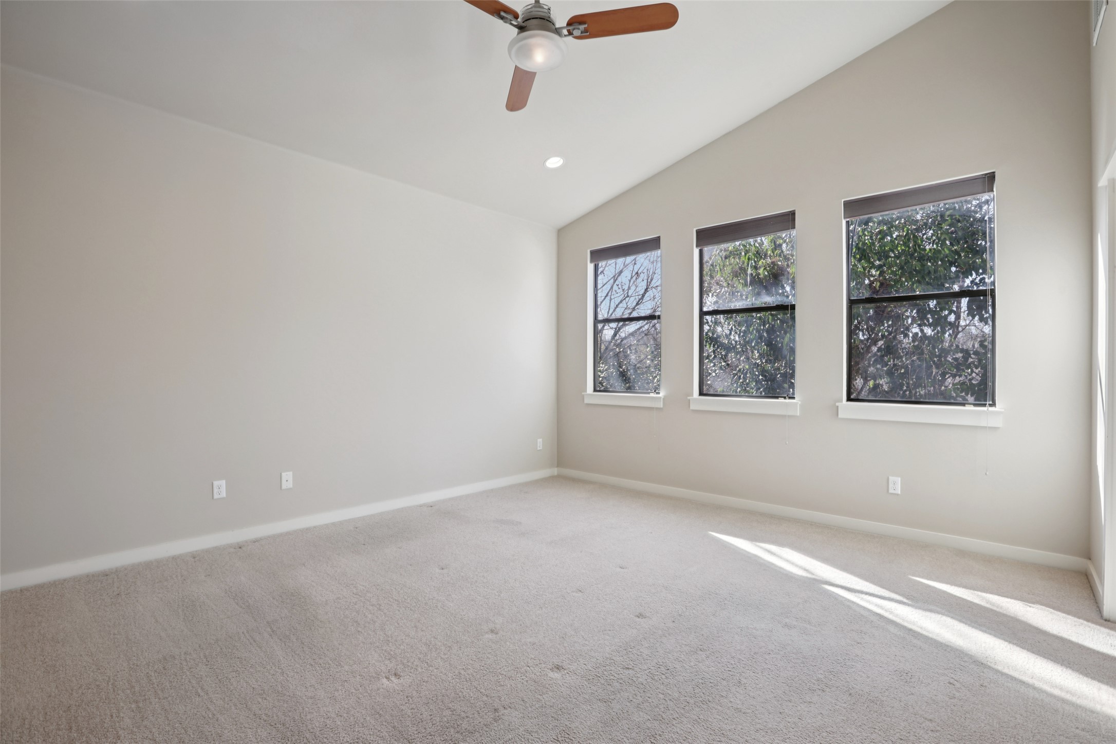 1123 Blair Way Austin, TX 78704 - Photo 13 of 25 an empty room with a window and a ceiling fan