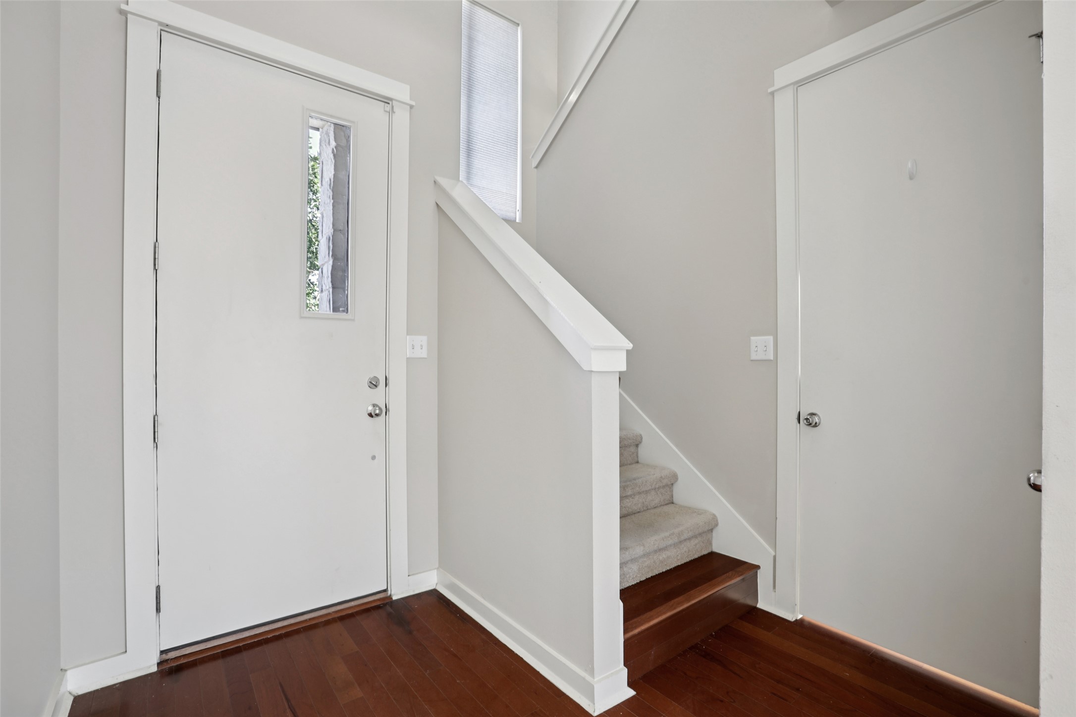 1123 Blair Way Austin, TX 78704 - Photo 4 of 30 Foyer entrance with stairway and dark wood finished floors