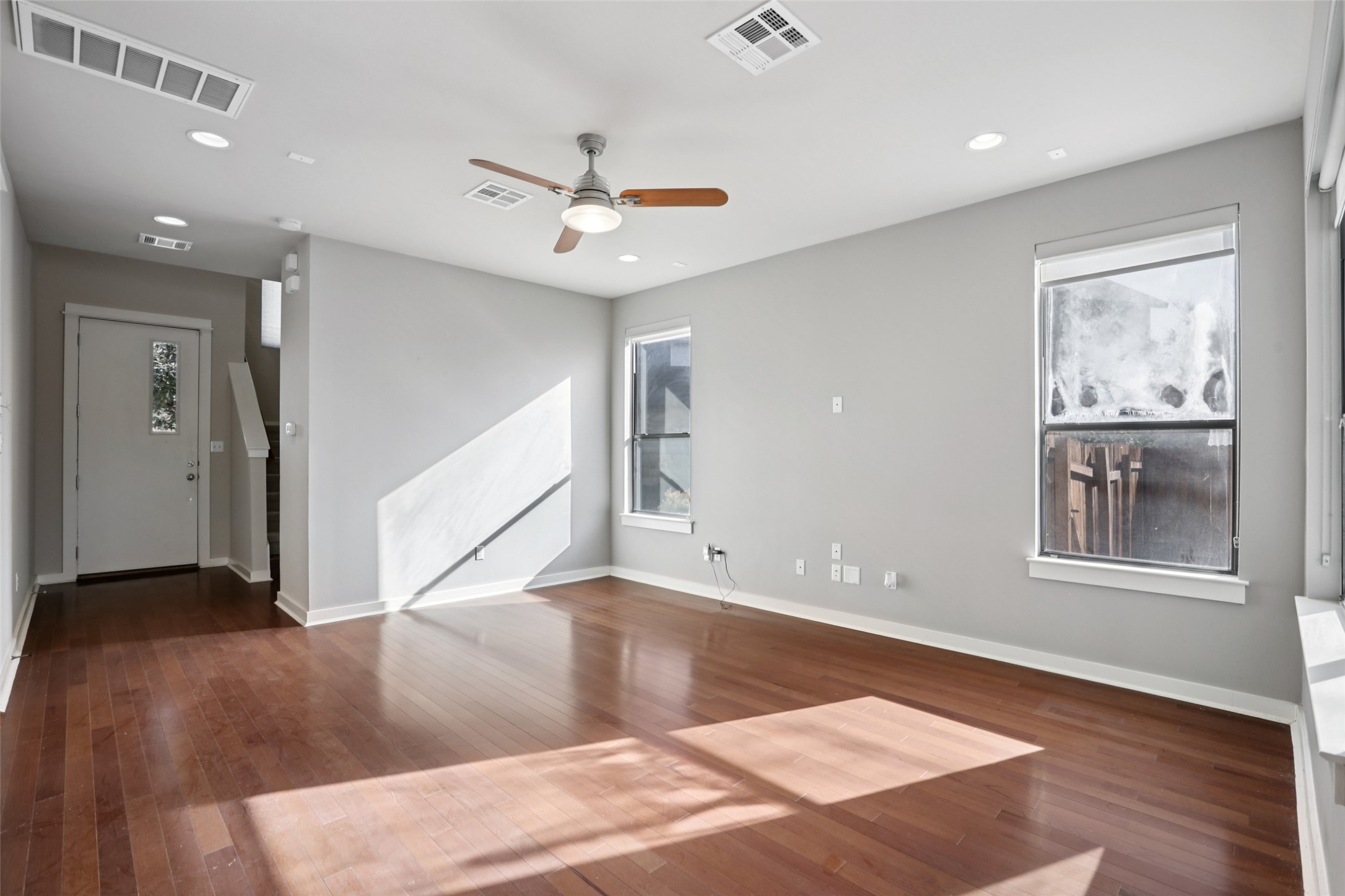 1123 Blair Way Austin, TX 78704 - Photo 5 of 30 Unfurnished room with dark wood-type flooring, recessed lighting, and ceiling fan