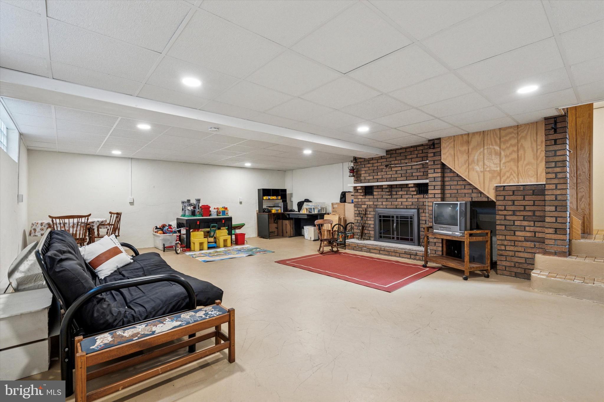 1742 Paradise Lane Bensalem, PA 19020 - Photo 15 of 25 a living room with furniture gym equipment and a flat screen tv