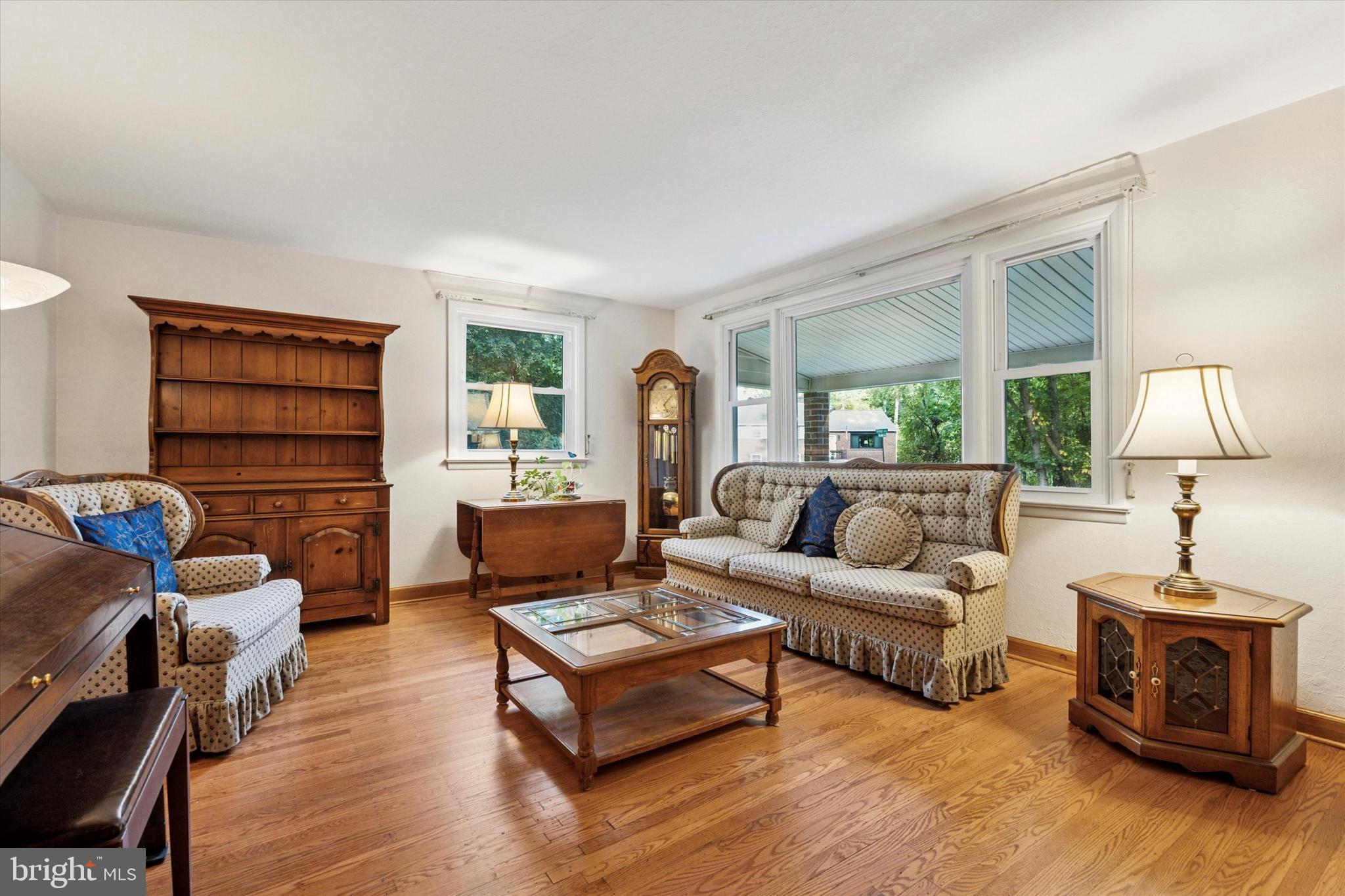 1742 Paradise Lane Bensalem, PA 19020 - Photo 4 of 25 a living room with furniture a lamp and a window