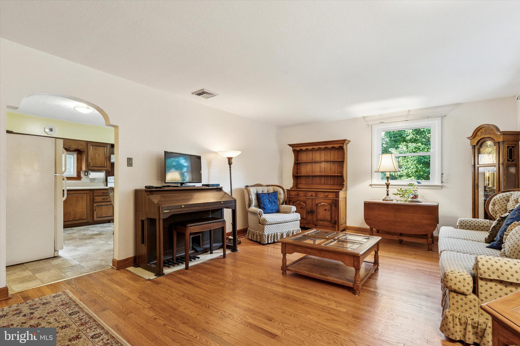 1742 Paradise Lane Bensalem, PA 19020 - Photo 5 of 25 a living room with furniture and a fireplace