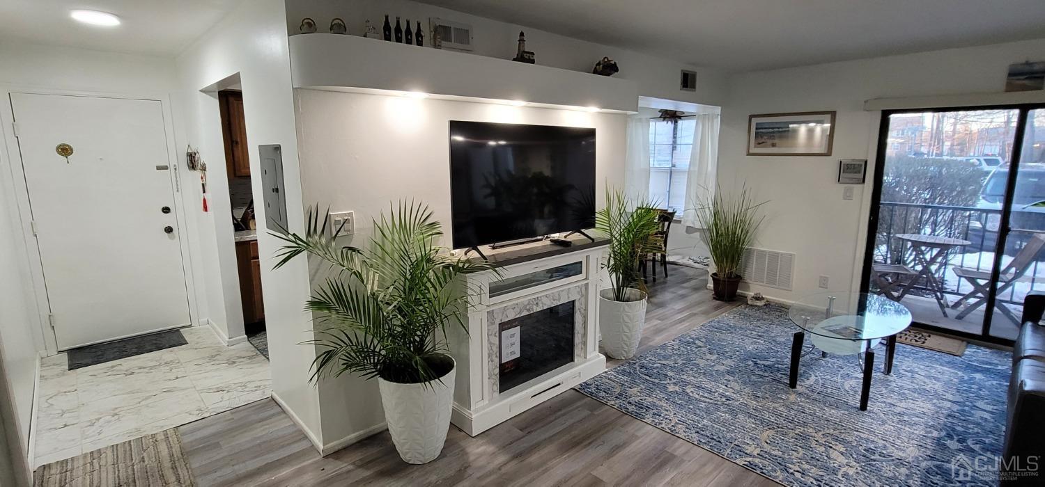 40 Boulder Drive Edison, NJ 08817 - Photo 11 of 23 a living room with furniture and a flat screen tv